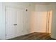 A bedroom features gray floors and a walk in closet with double doors at 1701 E Colter St # 191, Phoenix, AZ 85016