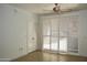 A bedroom has tile floors, a ceiling fan and large window at 1701 E Colter St # 191, Phoenix, AZ 85016