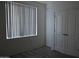 This bedroom features gray wood floors and a closet with double doors at 1701 E Colter St # 191, Phoenix, AZ 85016