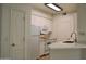 A bright kitchen has white cabinets, a white countertop and appliances at 1701 E Colter St # 191, Phoenix, AZ 85016