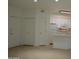 Open floor plan featuring a kitchen with white cabinets and a kitchen island at 1701 E Colter St # 191, Phoenix, AZ 85016