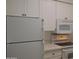 This is a well-equipped kitchen space with white cabinets and modern appliances at 1701 E Colter St # 191, Phoenix, AZ 85016