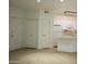 The open floor plan shows the kitchen with its white appliances and cabinets at 1701 E Colter St # 191, Phoenix, AZ 85016
