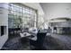 Bright lobby featuring a piano, modern furniture, and large windows with views of the courtyard at 1701 E Colter St # 191, Phoenix, AZ 85016
