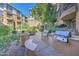 Community outdoor kitchen with built-in barbeque grills, cooking space, and patio seating area at 1701 E Colter St # 191, Phoenix, AZ 85016