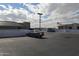 Upper level of parking garage with ample parking spaces and city skyline views at 1701 E Colter St # 191, Phoenix, AZ 85016