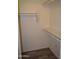 Walk-in closet with light gray flooring and white walls with shelving and rod at 1701 E Colter St # 191, Phoenix, AZ 85016