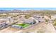 Desert house with modern fence, sunshade, artificial grass, and mountain views at 1727 E Hidalgo St, Apache Junction, AZ 85119