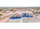 A well-kept one-story home with a three-car garage and pristine landscaping at 1727 E Hidalgo St, Apache Junction, AZ 85119