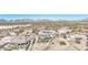 Captivating aerial view of desert home featuring serene desert landscaping and mountain backdrop at 1727 E Hidalgo St, Apache Junction, AZ 85119