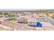 Aesthetic exterior aerial view of a desert property with fencing and serene landscaping at 1727 E Hidalgo St, Apache Junction, AZ 85119