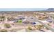 Elevated aerial view of desert community home with modern fence and tranquil desert surroundings at 1727 E Hidalgo St, Apache Junction, AZ 85119
