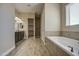 Elegant bathroom with a soaking tub, walk-in shower, and double vanity sinks at 1727 E Hidalgo St, Apache Junction, AZ 85119