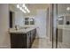 Bathroom featuring a double vanity with granite countertops and glass shower at 1727 E Hidalgo St, Apache Junction, AZ 85119