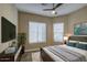 Cozy bedroom featuring plush bedding, neutral walls and ample natural light at 1727 E Hidalgo St, Apache Junction, AZ 85119