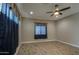 Bedroom boasts hardwood floors, a modern ceiling fan, and ample natural light at 1727 E Hidalgo St, Apache Junction, AZ 85119