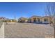 Desert home with a circular gravel driveway, three car garage and mountain views at 1727 E Hidalgo St, Apache Junction, AZ 85119
