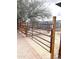 This metal gate offers a secure entrance to the horse property, ensuring safety and peace of mind for animal owners at 1727 E Hidalgo St, Apache Junction, AZ 85119
