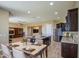 Open concept kitchen and dining area with granite countertops and stainless steel appliances at 1727 E Hidalgo St, Apache Junction, AZ 85119