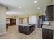 Open kitchen with a large island, stainless steel appliances, and hardwood flooring at 1727 E Hidalgo St, Apache Junction, AZ 85119