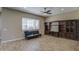 Living room featuring wood-look tile flooring and a built-in media center at 1727 E Hidalgo St, Apache Junction, AZ 85119