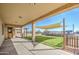 Enjoy this covered patio with artificial grass, perfect for pets, with sun shades and a private fence at 1727 E Hidalgo St, Apache Junction, AZ 85119