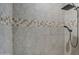 Close up on the tiled shower with shower head and handheld sprayer at 1727 E Hidalgo St, Apache Junction, AZ 85119