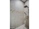Tiled shower featuring shower head and handheld sprayer at 1727 E Hidalgo St, Apache Junction, AZ 85119