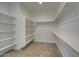 Spacious walk-in closet with built-in shelving and ample storage space at 1727 E Hidalgo St, Apache Junction, AZ 85119