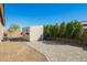 Backyard with a charming storage shed, desert landscaping, and well-maintained walkway at 18006 W Hess St, Goodyear, AZ 85338