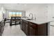 Gourmet kitchen island offers ample counter space and an open view into the dining and living area at 18006 W Hess St, Goodyear, AZ 85338