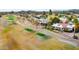 Aerial view of a home next to a golf course, showcasing mature trees and well-maintained landscaping at 18727 E Avenida Del Ray --, Rio Verde, AZ 85263