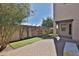 Backyard features a paved patio, artificial turf, and exterior wall at 1930 E Hayden Ln # 118, Tempe, AZ 85281