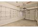 Attached garage with ample wall-mounted storage shelving at 1930 E Hayden Ln # 118, Tempe, AZ 85281