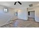 Open living room with wood floors, neutral walls, and bright windows create a welcoming space at 1930 E Hayden Ln # 118, Tempe, AZ 85281
