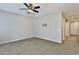 Neutral living room with tile flooring, ceiling fan, and easy access to the hall with an installed tv bracket at 1930 E Hayden Ln # 118, Tempe, AZ 85281