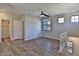 Spacious loft area with wood-look floors, ceiling fan, and bright windows at 1930 E Hayden Ln # 118, Tempe, AZ 85281