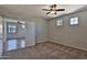 Large main bedroom has plush carpet, ceiling fan, and multiple windows for natural light at 1930 E Hayden Ln # 118, Tempe, AZ 85281