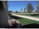 Expansive backyard view showcasing a manicured lawn, mature trees, and a tranquil outdoor setting at 19420 N Westbrook Pkwy # 510, Peoria, AZ 85382