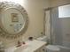 Cozy bathroom features a unique mirror, a single sink vanity, and a shower-tub combo at 19420 N Westbrook Pkwy # 510, Peoria, AZ 85382