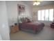 Bedroom with neutral walls, a patterned bedspread, and large windows with blinds at 19420 N Westbrook Pkwy # 510, Peoria, AZ 85382