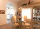 Dining room with neutral walls, chandelier, large display cabinet, and access to the kitchen at 19420 N Westbrook Pkwy # 510, Peoria, AZ 85382