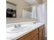Bathroom with double sinks, wood vanity, and a shower/tub combo with neutral finishes at 2225 E Andalusian Loop, San Tan Valley, AZ 85140