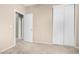 Bedroom with neutral carpet, closet, and doorway to an adjacent room at 2225 E Andalusian Loop, San Tan Valley, AZ 85140