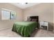 Simple bedroom with a comfortable bed, natural light, and a clean, neutral color palette at 2225 E Andalusian Loop, San Tan Valley, AZ 85140