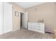 Bedroom featuring carpet, sliding door closet, dresser and wall decor at 2225 E Andalusian Loop, San Tan Valley, AZ 85140