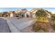 Quaint single-level home with desert landscaping and a long driveway at 2225 E Andalusian Loop, San Tan Valley, AZ 85140
