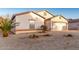 Inviting single-Gathering house with desert landscaping and an attached two-car garage at 2225 E Andalusian Loop, San Tan Valley, AZ 85140