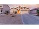 Charming single-story home with a two car garage and desert landscaping at 2225 E Andalusian Loop, San Tan Valley, AZ 85140