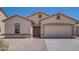 Attractive single-story home featuring a two-car garage and low-maintenance yard at 2225 E Andalusian Loop, San Tan Valley, AZ 85140